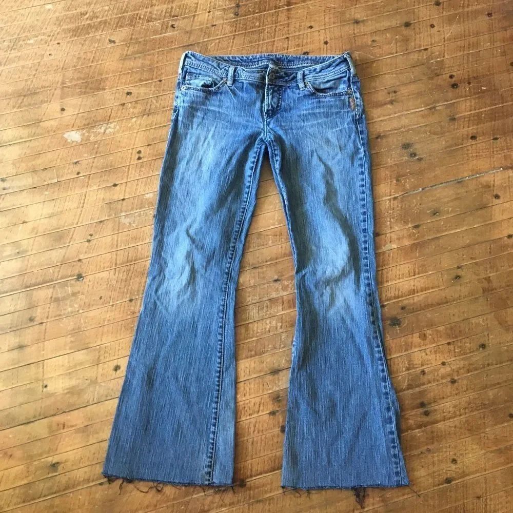 Silver bootcut, distressed raw hem jeans